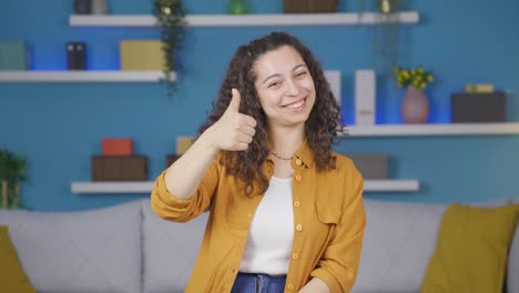 Young-woman-making-positive-gesture-at-camera.